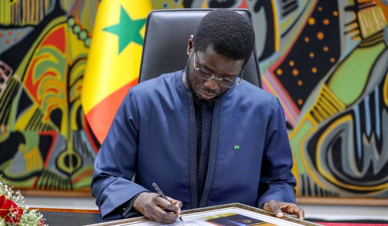 President Bassirou Diomaye signing decree
