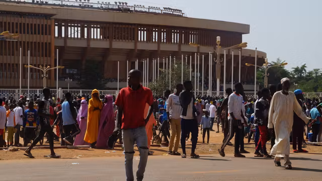 Civilians in Niger gather at Niamey’s General Seyni Kountché Stadium for recruitment into a new civilian defense militia on August 19, 2023.