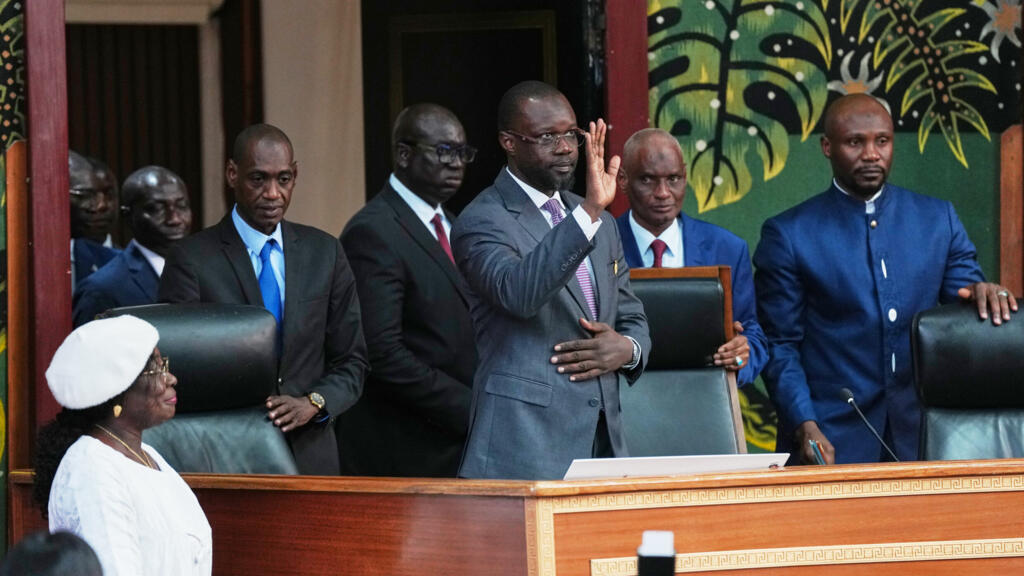 Ousmane Sonko, center, arrives to deliver a speech following his election as President of the National Assembly on Tuesday, May 26, 2026, in Dakar.