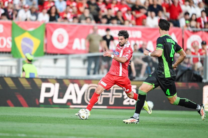 Patrick Cutrone and Monza players celebrate their Serie A return despite the playoff final scare against Catanzaro