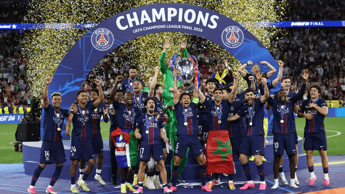 PSG players celebrate their historic Champions League victory with the iconic trophy.