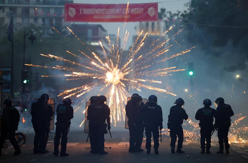 Fireworks explode as police disperse crowds in Paris