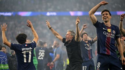 PSG coach Luis Enrique celebrates with his players after victory against Arsenal in the Champions League final on May 30, 2026 in Budapest