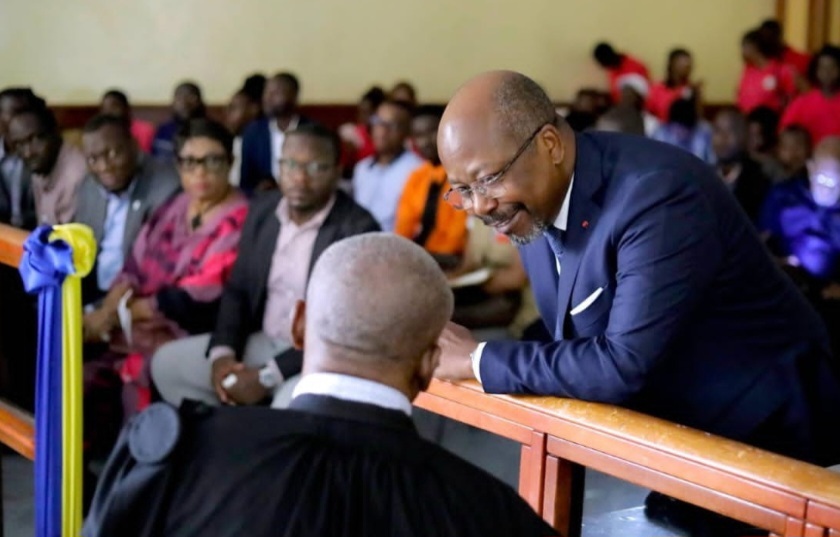 Alain-Claude Bilie By Nze with his lawyer during a social media trial at the courtroom