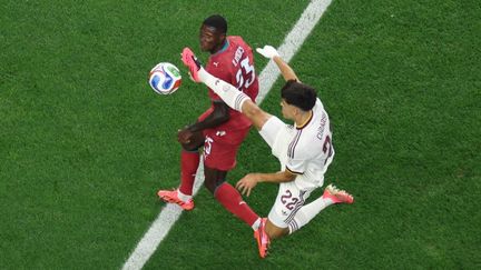 Portugal's Nuno Mendes challenges Spain's defender during the World Cup 2026 Round of 16 match