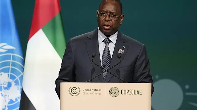 Macky Sall and Diomaye Faye shaking hands during a political event