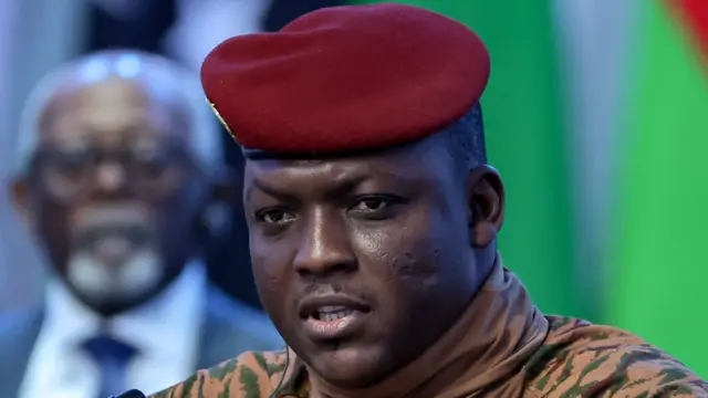 Close-up of Ibrahim Traoré in military uniform wearing a red beret