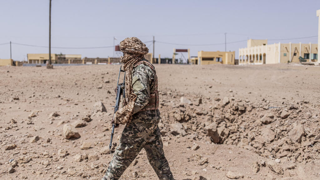 A soldier from the National Front for the Liberation of Azawad (FLA) inspecting a crater from a Malian air strike in Kidal on May 14, 2026.