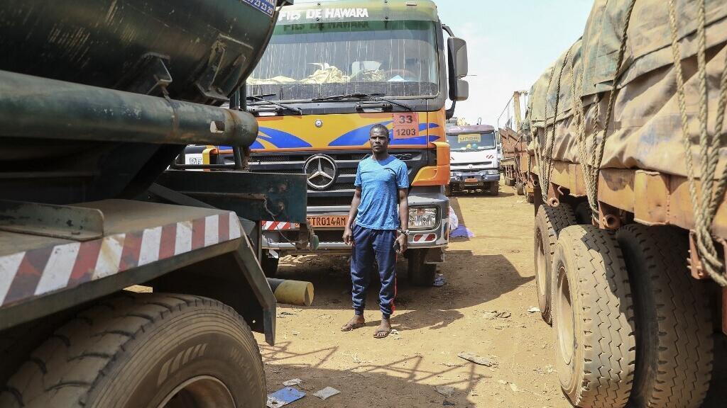 Trucks waiting on the main road connecting Bangui in the Central African Republic to Douala, Cameroon (illustrative image).